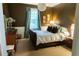 Comfortable bedroom with earth tones, a large window, and warm, natural light at 2800 Memorial Se Dr, Atlanta, GA 30317
