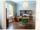 Charming dining room with a mid-century modern aesthetic and designer lighting fixture at 2800 Memorial Se Dr, Atlanta, GA 30317