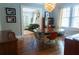Well lit dining room with hardwood floors, stylish furniture, and view to living room at 2800 Memorial Se Dr, Atlanta, GA 30317