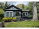 This lovely house has a bright green door, and is surrounded by mature trees and manicured green lawn at 2800 Memorial Se Dr, Atlanta, GA 30317