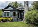 Charming craftsman style home featuring a striking, arched entry and lush landscaping at 2800 Memorial Se Dr, Atlanta, GA 30317
