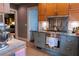 Cozy kitchen featuring stainless steel appliances and custom cabinets with views to the bedroom at 2800 Memorial Se Dr, Atlanta, GA 30317