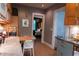 Galley kitchen featuring stainless appliances, custom cabinets and breakfast nook with views to the bedroom at 2800 Memorial Se Dr, Atlanta, GA 30317