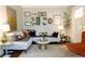 Cozy living room featuring a stylish couch, decorative pillows, and unique wall decor at 2800 Memorial Se Dr, Atlanta, GA 30317