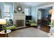 Relaxing living room with hardwood floors, a painted brick fireplace, and comfortable seating at 2800 Memorial Se Dr, Atlanta, GA 30317