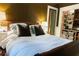Comfortable bedroom with earth tones, a bright window, and closet at 2800 Memorial Se Dr, Atlanta, GA 30317