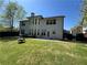 Large, level backyard with a dark wood privacy fence, a patio, and plenty of green space at 2964 Olivine Dr, Dacula, GA 30019