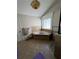Bathroom with a corner tub surrounded by tile, a window, and neutral decor at 2964 Olivine Dr, Dacula, GA 30019