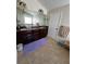 Bathroom featuring double vanity, tile flooring, and ample counter space at 2964 Olivine Dr, Dacula, GA 30019