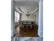 Elegant dining room with hardwood floors, chandelier, tray ceiling, and wainscoting at 2964 Olivine Dr, Dacula, GA 30019