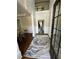 Inviting foyer with hardwood floors, wainscoting, high ceilings, and an elegant rug at 2964 Olivine Dr, Dacula, GA 30019