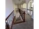 Upstairs hallway with decorative iron railing overlooking the staircase and lower level at 2964 Olivine Dr, Dacula, GA 30019