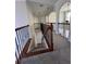 Upstairs hallway with decorative iron railing overlooking the staircase leading to the lower level at 2964 Olivine Dr, Dacula, GA 30019