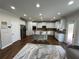 Spacious kitchen with white cabinetry, stainless steel appliances, and a large center island at 2964 Olivine Dr, Dacula, GA 30019