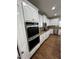Modern kitchen featuring stainless steel appliances, white cabinetry, and granite countertops at 2964 Olivine Dr, Dacula, GA 30019