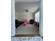 Cozy living room featuring plush carpeting and a play area with rocking horses and toys at 2964 Olivine Dr, Dacula, GA 30019