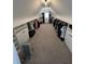 Long walk-in closet with custom shelving, rods, and carpeted floors, offering ample storage at 2964 Olivine Dr, Dacula, GA 30019