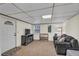 Finished basement featuring carpet flooring, a sofa, TV and exterior access at 4917 Baker Ridge Pl, Acworth, GA 30101