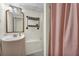 Basement bathroom with simple design and pink shower curtain at 4917 Baker Ridge Pl, Acworth, GA 30101