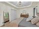 A cozy bedroom with a tray ceiling, carpet flooring, and a lovely cushioned bed at 4917 Baker Ridge Pl, Acworth, GA 30101