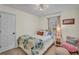 Cozy bedroom featuring a comfortable bed and chair at 4917 Baker Ridge Pl, Acworth, GA 30101