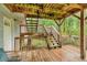An outdoor deck with wooden steps and railings surrounded by lush greenery at 4917 Baker Ridge Pl, Acworth, GA 30101