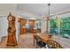 Light-filled dining area with backyard access and wooden table at 4917 Baker Ridge Pl, Acworth, GA 30101