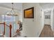Foyer features beautiful chandelier and well-lit staircase at 4917 Baker Ridge Pl, Acworth, GA 30101