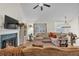 Spacious living room featuring a fireplace, large windows, and hardwood floors at 4917 Baker Ridge Pl, Acworth, GA 30101