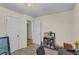 A room with a desk and a bookcase and a view to the hallway at 4917 Baker Ridge Pl, Acworth, GA 30101