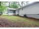 Backyard with mature trees, a screened-in porch, and tranquil setting at 5819 Stonehaven Nw Dr, Kennesaw, GA 30152