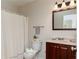 Cozy bathroom featuring a wood vanity, framed mirror, and shower with curtain at 5819 Stonehaven Nw Dr, Kennesaw, GA 30152