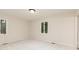 Inviting bedroom with carpet, neutral paint, and windows providing ample natural light at 5819 Stonehaven Nw Dr, Kennesaw, GA 30152