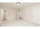 Large bedroom with plush carpet, fresh paint, and an adjacent bathroom at 5819 Stonehaven Nw Dr, Kennesaw, GA 30152
