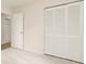 Bedroom with closet featuring folding doors, neutral carpet, and light walls at 5819 Stonehaven Nw Dr, Kennesaw, GA 30152