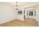 Dining room features wood-look floors and a view into the adjacent kitchen at 5819 Stonehaven Nw Dr, Kennesaw, GA 30152
