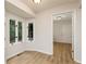 Bright entryway features wood-look floors, large windows, and natural light at 5819 Stonehaven Nw Dr, Kennesaw, GA 30152