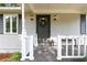 Inviting front porch with welcome sign and charming details to the home's entrance at 5819 Stonehaven Nw Dr, Kennesaw, GA 30152