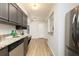 Kitchen with stainless steel appliances, granite countertops, cabinetry and a serving hatch at 5819 Stonehaven Nw Dr, Kennesaw, GA 30152
