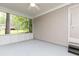 Comfortable screened porch with views of the wooded backyard and an exit door at 5819 Stonehaven Nw Dr, Kennesaw, GA 30152