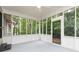 Enclosed screened porch with abundant natural light and access to the backyard at 5819 Stonehaven Nw Dr, Kennesaw, GA 30152