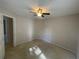 Neutral bedroom featuring a ceiling fan and plush carpeting at 8100 Greens Mill Way, Loganville, GA 30052