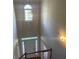 Bright foyer with high ceilings, transom window, and decorative light fixture at 8100 Greens Mill Way, Loganville, GA 30052