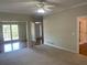 Spacious living room with ceiling fan, transitions to hardwood floors and entryway at 8100 Greens Mill Way, Loganville, GA 30052
