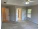Spacious main bedroom featuring neutral walls and doors to the main bathroom at 8100 Greens Mill Way, Loganville, GA 30052