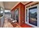 Inviting front porch with seating, brick accents, and a view of the surrounding landscape at 8100 Greens Mill Way, Loganville, GA 30052