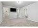 Bedroom with an open door to the walk-in closet and ensuite bathroom, ready for personalization at 104 Marlow Dr, Woodstock, GA 30188