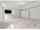 Large bedroom featuring tray ceilings, neutral colored walls, and a carpeted floor at 104 Marlow Dr, Woodstock, GA 30188