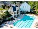 Community swimming pool with a pavilion, lounge chairs, and lush landscaping, ideal for relaxation and recreation at 104 Marlow Dr, Woodstock, GA 30188