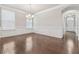 Bright dining room features hardwood floors, fresh paint, modern chandelier and decorative wall trim at 104 Marlow Dr, Woodstock, GA 30188